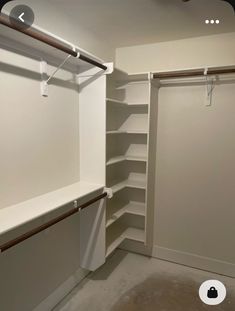 an empty walk in closet with white walls