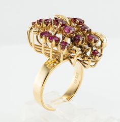 Genuine Ruby Ring, Floral Ring, July Birthstone, Flower Ring, 14K Gold Ring, Natural Ruby, Natural Diamond Ring, Estate Ring, Cocktail Ring, Red Ring. This beautiful vintage ring is finely crafted in solid 14K Yellow Gold and it is also numbered inside of the shank. This colorful ring has Twenty-two genuine Earth mined Rubies measure from 2mm to 3mm, they are high-quality gems with great intensity and very strong brilliance. Eight small but white and fiery genuine diamonds are estimated to be VS Vintage Multi-stone Ruby Ring In 14k Gold, Vintage Gold Cluster Ruby Ring, Vintage Gold Ruby Cluster Ring, Vintage Ruby Cluster Ring For Formal Occasions, Vintage Ruby Cluster Ring For Formal Events, Gold Cluster Ruby Ring Hallmarked, Gold Cluster Ruby Ring, Hallmarked, Vintage Ruby Multi-stone Cluster Ring, Vintage Ruby Cluster Ring With Multi-stones