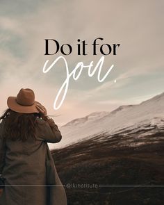 a woman wearing a hat and coat looking at the mountains with text that reads, do it for joy