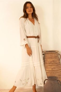 Beautifully handcrafted in Bali, the Stevie Dress is a true work of art. Featuring shell buttons, romantic details of cotton lace and pintucks, and elegant artisan handmade embroidery and cut work at the sleeves and hem. The Stevie can effortlessly be pulled on to elevate any outfit from a casual look to a date night with her flowing silhouette. Style her loose and relaxed or tie her at the waist with her sash belt. Responsibly Handcrafted by women artisans using luxurious sustainable fabrics ce Stevie Dress, Black Strappy Sandals, Eco Friendly Clothing, Ruffle Collar, Lace Insert, Different Outfits, Cut Work, White Midi Dress, Hoodies For Sale