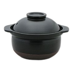 a black pot with brown rim and lid