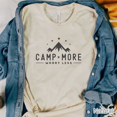 If you're looking for a stylish and comfortable camping shirt for your next outdoor adventure, then you should check out our Camp More Worry Less Shirt! This mountain design t-shirt is perfect for any outdoor lover and is made from soft and breathable fabric for a comfortable fit all day long.  Bella & Canvas 3001 Shirt Size up 1 to 2 sizes for an oversized look. This classic unisex jersey short-sleeve tee fits like a well-loved favorite. Soft cotton and quality print make users fall in love wit Letter Print Crew Neck Top For Outdoor, Cotton Graphic Print Camp Shirt For Outdoor Activities, Graphic Tee Shirt With Letter Print For Outdoor Activities, Casual Crew Neck Camp Shirt For Outdoor Activities, Casual Cotton Camp Shirt For Camping, Casual Graphic Print Camp Shirt, Casual Cotton Camp Shirt, Casual Letter Print Tops, Casual Crew Neck Shirt For Camping