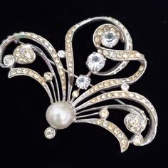 This 2 1/2 Inch Wide Brooch Has A Very Art Nouveau Or Edwardian Style. 3 Rhinestone Enrusted Flowing Leaves Sprout From The Faux Pearl Center With Larger Rhinestones For Accents. Very Swirly And Elegant. It Is Marked Sterling With A Rhodium Plate. Unfortunately Not Signed By A Maker But A Truly Outstanding Piece. A Few Stones Have Darkened Slightly But Other Than That It Is In Remarkably Good Condition. C. 1940's Or Earlier. Edwardian Style, Edwardian Fashion, Vintage Silver, Rhodium Plated, Faux Pearl, Vintage Art, Art Nouveau, Vintage Ladies, Women Jewelry