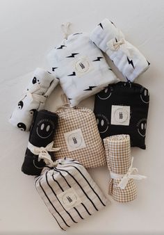 several cloths are laid out on top of each other in different patterns and sizes