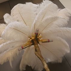 a large white feather flower on display in a store