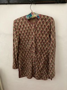 Beautiful example of early Anokhi Indian block  print blouse/ unlined jacket . In great vintage condition . One replaced button hardly noticeable . Measures pit to pit  17 inches length 28 inches Fitted Nehru Jacket With Floral Print And Long Sleeves, Fitted Long Sleeve Nehru Jacket With Floral Print, Traditional Long Sleeve Outerwear With Printed Motifs, Traditional Nehru Jacket With Floral Print, Traditional Floral Print Blouse For Fall, Festive Vintage Long Sleeve Blouse, Festive Vintage Long-sleeve Kurta, Patterned Long Sleeve Kurta With Kalamkari Print, Traditional Long Sleeve Nehru Jacket With Buttons