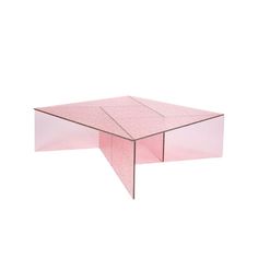 a pink coffee table with an angled design on the top and one section missing from it