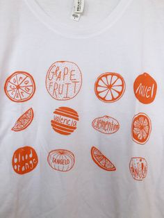 Hand Drawn and Hand Printed! This is a screen printed boxy tee crop top with a variety of hand drawn citrus- oranges and grapefruit! The shirt shown here is white and is printed in orange ink. // PROCESS: All of our items are individually hand printed by either me or my dad, which can lead to slight variations in placement. The ink is heat cured and will not fade over time. Since our items are printed to order, there is a 1-2 week processing time before shipping. If you absolutely need an item s Cheap Graphic Tee With Fruit Print, Cheap Fruit Print Short Sleeve T-shirt, Cheap White T-shirt With Fruit Print, Cheap Short Sleeve T-shirt With Fruit Print, Affordable Casual T-shirt With Fruit Print, Cheap Relaxed Fit Fruit Print Tops, Cheap White T-shirt With Fruit Design, Cheap Trendy Tops With Fruit Design, Cheap Casual Fruit Print T-shirt