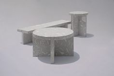 two concrete benches sitting next to each other