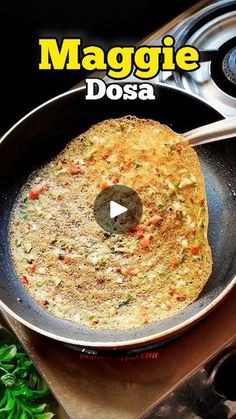 an omelet is being cooked in a skillet on the stove with words maggie dosa