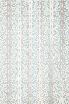 a blue and white striped wallpaper with an ornate design