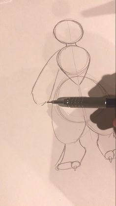 someone is drawing a cartoon character with a pencil