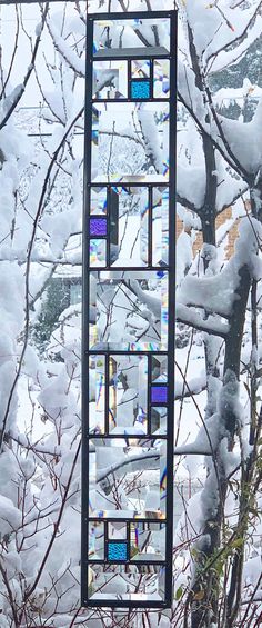 there is a stained glass window in the snow