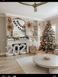 a living room filled with furniture and a christmas tree