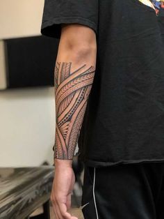 a man with a tattoo on his arm