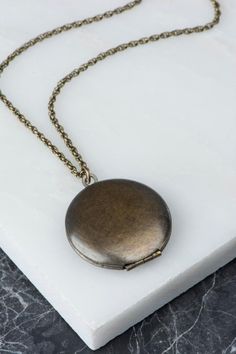 Dark finish brass locket necklace with sleek and simple design. This wonderful round vintage locket has a slight but beautiful wear reflecting decades of use. Great to wear on its own or in a layered look. Ready for your pictures! D E T A I L S : •Photo #1, 5, 6 & 7: 28 length •Photo #3: 26 Angelica Garcia, Photo Chain, Vintage Locket, Antique Locket, Photo Locket Necklace, Winter Jewelry, Vintage Lockets, Brass Antique, Platinum Jewelry