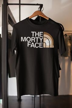 the north face t - shirt hanging on a rack