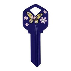 a blue key with a butterfly and flowers on the back of it's face