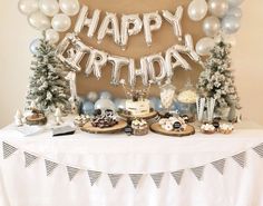 a birthday party with balloons and desserts