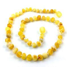 a necklace and bracelet made out of yellow beads