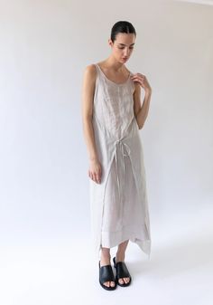 Sayaka Davis Sheer Wrap Dress in Sand – VESTIGE Spring Sleeveless Wrap Dress With Straps, Sleeveless Wrap Dress With Wrap-around Straps, Summer Sleeveless Dress With Drawstring Tie, Sleeveless Summer Dresses With Wrap-around Straps, Summer Wrap Maxi Dress For Daywear, Casual Sleeveless Dress With Drawstring Tie, Sleeveless Summer Wrap Dress With Wrap-around Straps, Sleeveless Wrap Dress With Wrap-around Straps For Summer, Sleeveless Wrap Dress With Straps For Summer