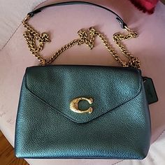 Stunning Metallic Green Coach Bag With Gold Hardware. Can Be Worn In Two Styles Shoulder Or Crossbody. Little Jewels On The Emblem In The Front Make This Piece Unique. Only Worn Once, Protective Stickers Still Intact On Hardware. Fits A Lot! Luxury Coach Flap Bag, Green Coach Shoulder Bag For Evening, Coach Clutch Satchel For Formal Occasions, Evening Coach Shoulder Bag With Magnetic Closure, Luxury Green Flap Bag, Coach Formal Bags With Branded Hardware, Luxury Coach Bags With Magnetic Closure, Formal Coach Bag With Branded Hardware, Formal Green Coach Bag