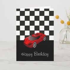 a birthday card with a red sports car