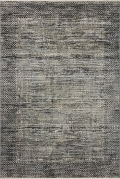 an area rug with different colors and patterns on the carpet, including grays and browns