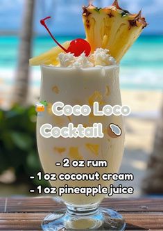 an ice cream sundae with pineapple and coconut on the beach