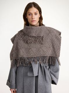 Forgo the classic scarf this season and opt for the bohemian bib. With its plush fringe trims, wide shoulders, and wool fabrication, the Turtlas design will add elegance and warmth to your outerwear edit. It’s key detail? The small, embroidered monogram in its front. Wide Shoulders, Embroidered Monogram, Pretty Blouses, The Bohemian, Athleisure Wear, Malene Birger, By Malene Birger, Knitwear Tops, Fringe Trim