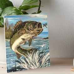 a painting of a fish jumping out of the water art board print by artist mark brile