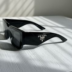 Like New Prada Sunglasses In All Black And Classic Logo On The Side. Comes With Everything. Prada Accessories, Prada Sunglasses, Classic Logo, Colored Sunglasses, On The Side, All Black, Sunglasses Accessories, Limited Time, Prada