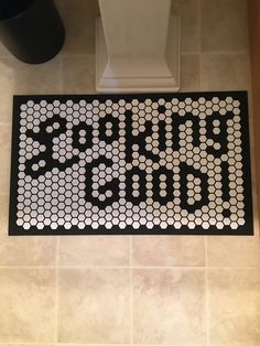 a black and white door mat that says start today on it in front of a toilet