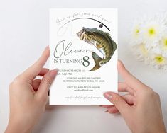 two hands holding up a card with a fish on it and the words, fishing is turning 8