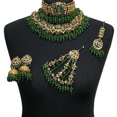 Green bridal luxury Kundan jewellery set. Set includes-   Earrings  Tikka Necklace (2 piece choker and necklace)  Jhumar Green Kundan Bollywood Jewelry, Green Bollywood Jewelry For Festive Season, Green Bollywood Jewelry With Stone Work, Bollywood Style Green Jewelry With Stone Work, Green Kundan Ceremonial Sets, Ceremonial Green Kundan Sets, Elegant Green Lehenga With Stone Work, Green Bridal Sets For Diwali Ceremonial, Festive Kundan Bridal Necklace With Jewels