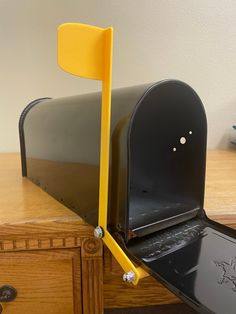 an open mailbox sitting on top of a wooden desk