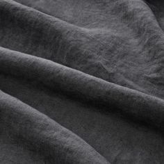 the fabric is very dark grey and it looks like linen