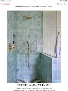 a bathroom with blue tiles on the wall and shower head in the corner, next to a bathtub