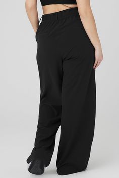 Your wildest trouser dreams just came true. The High-Waist Dreamscape Trouser takes the iconic pleats and silhouette of trousers and takes the look to the next level with lightweight crinkle woven fabric that breathes, moves and sets trends wherever it goes. Layer over a bodysuit or pair with the matching Dreamscape Button Down Long Sleeve! Trouser with lightweight crinkle fabric High waisted with wide leg silhouette Side pockets & faux back welt pockets Designed & uniquely fit to flatter every size Wear-tested by our in-house team for the perfect fit Alo Yoga Wide Leg Casual Bottoms, Versatile Alo Yoga Bottoms, 4-way Stretch Wide Leg Trousers With Elastic Waistband, Alo Yoga Relaxed Fit Pants With Elastic Waistband, Black Stretch Alo Yoga Bottoms, Alo Yoga Relaxed Fit Wide Leg Bottoms, Alo Yoga Black Stretch Bottoms, Alo Yoga Solid Color Pants With Elastic Waistband, Alo Yoga Wide Leg Pants With Elastic Waistband