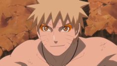 an anime character with orange eyes and no shirt on sitting in front of some rocks