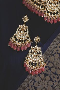 Gold Plated kundan and uncut polki set on a silver and copper alloy base. This necklace set is plated with 22k gold and embellished with semi precious rose quartz stones. Heavy necklace set with chandbaali earrings for bridal dressing.This Sabyasachi inspired necklace with a twist of coloured stones by Paisley Pop is a perfect accessory for an Indian Bride. Kundan Gold Plated Indian Bridal Jewellery with Emerald Green stones and light Pink agate stones, Semi precious Uncut Kundan Polki Indian We Indian Wedding Necklace, Heavy Necklace, Emerald Green Stone, Indian Bridal Jewellery, Chandbali Earrings, Pink Rose Quartz, Green Stones, Inspired Necklace, Choker Necklace Set