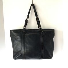 COACH Large East West Black Leatherware Shoulder Tote Bag VGUC. Please Note: There is some cracking on the strap sides. However, they are structurally sound. Black Leather Bag With Silver-tone Hardware, Classic Satchel With Silver-tone Hardware For Errands, Leather Shoulder Bag With Silver-tone Hardware For Errands, Coach Leather Shoulder Bag With Handles, Leather Travel Bags With Branded Hardware, Coach Black Shoulder Bag For Errands, Classic Shoulder Bag With Branded Hardware For Errands, Coach Leather Bag With Silver-tone Hardware, Coach Satchel With Gunmetal Hardware For Travel