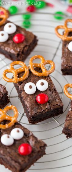 some brownies with pretzels and reindeer noses on them