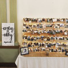 a table topped with pictures and framed photos