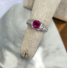 Burma, also known as Myanmar, has a long history of producing some of the finest rubies in the world. This ruby is a delightful pinkish-red color in a rounded oval shape. The platinum setting is exquisite with diamond pave set along every angle. Note there are 4 small diamonds set under the ruby, as extra accents. The ruby weighs 1.17ct and  0.77 carats of white and clean diamonds. All weights are stamped in the shank. Ring size is 6, can be sized upon request 7.3 grams of Platinum The integrity Rolls Royce Gold, Lirika Matoshi, Aesthetic Rings, Unique Rings Vintage, Multicolor Jewelry, Pinkish Red, Platinum Diamond Rings, Long History, Red Band