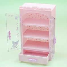 a pink doll's closet with its door open next to a card board and mirror