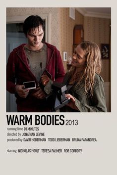 two people standing next to each other in front of a poster with the words warm bodies 2013