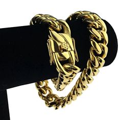 Men's 20" long x 18mm wide Cuban choker. 24k gold plated over solid stainless steel. Chunky cuban chain weighs well over 290 grams - has a premium feel. Stylish, strong and secure box lock clasp. Take your game to the next level with this solid stainless steel chain necklace. 100% FREE SHIPPING in USA. Order now! Cuban Choker, Cuban Chain Necklace, Stainless Steel Chain Necklace, Hip Hop Jewelry, Cuban Chain, Steel Chain, Stainless Steel Chain, Choker, Chain Necklace