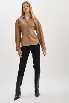 Indulge your fashion sensibilities with the irresistible allure of the Skylar Faux Leather Shirt. Designed to captivate, this statement piece boasts an hourglass silhouette & tapered waist. Classic Fitted Leather Tops, Fitted Classic Leather Tops, Fitted Classic Leather Top, Elegant Leather Tops For Work, Modern Fall Blouse For Night Out, Modern Blouse For Night Out In Fall, Modern Blouse For Fall Night Out, Fitted Leather Button-up Top, Modern Leather Tops For Workwear