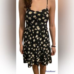 Brand New, Never Been Worn, Floral Dress, Black With Little Yellow And White Flowers. Adjustable Straps. Elastic Back. Removeable Pads In Bust. Slight Ruffles On The End. Medium Casual Fitted Floral Print Sundress, Spring Casual Sundress With Daisy Print, Casual Summer Sundress With Daisy Print, Casual Daisy Print Sundress For Summer, Black Casual Sundress For Spring, Casual Black Sundress For Spring, Black Fitted Casual Sundress, Fitted Black Dress With Daisy Print, Fitted Black Casual Sundress